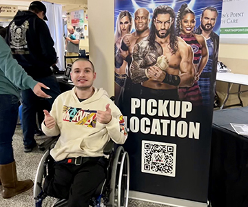 Young man in wheelchair at event